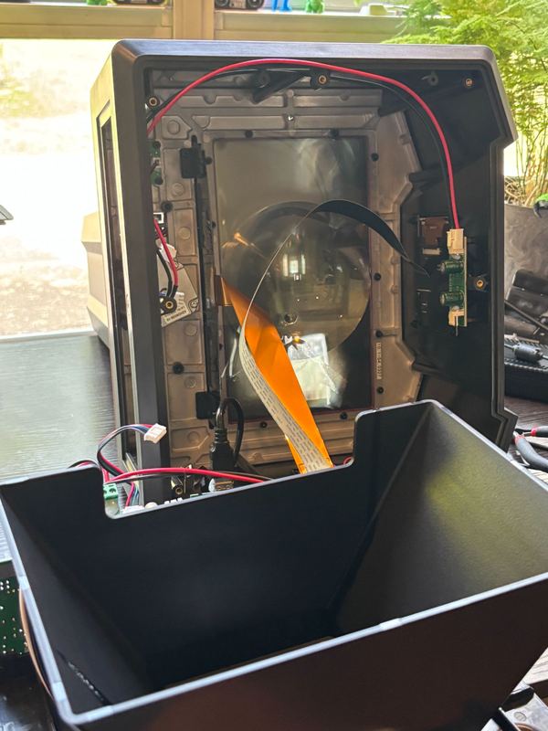 Inside of a 3D printer enclosure during a repair