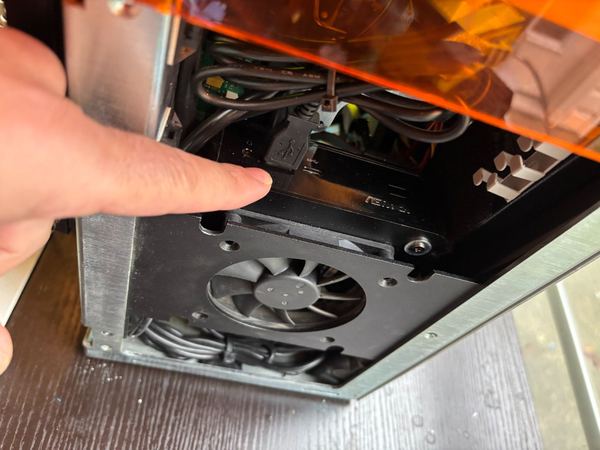 Cooling fan being serviced inside a 3D printer