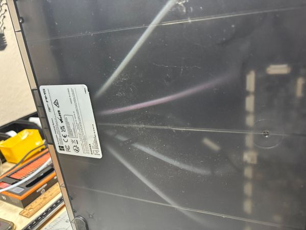 Inside the frame of a 3D printer during maintenance