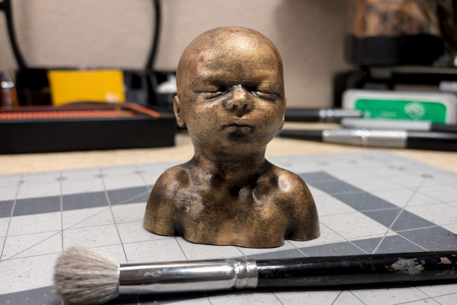 Bronze-finish 3D-printed baby sculpture made from an ultrasound