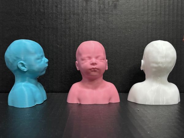 Baby sculptures in blue, pink and white